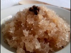 a close up of a plate of food with sugar and raisins on it