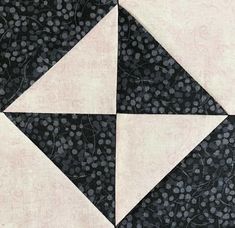 the black and white quilt has four triangles on it