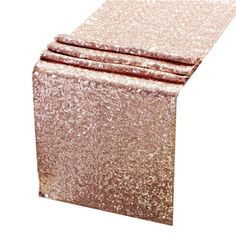 three pieces of pink glitter fabric on top of each other in front of a white background