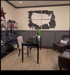 a living room with two chairs and a coffee table in front of a book shelf