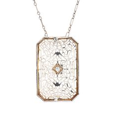 Finely detailed vintage Art Deco drop necklace (circa 1920s to 1930s), crafted in 14 karat white gold.   The drop is set with an estimated 0.04 carat Old European cut diamond (estimated at H-I colour and SI1 clarity).    The die-struck necklace features intricate and lacy filigree detail. The chain is comprised of longer bar links attached to smaller round links. The necklace measures 17 inches and sits nicely at the nape of the neck. The filigree necklace was very popular during the era and is Antique White Gold Necklace With Diamond Accents, Antique White Gold Diamond Necklace With Single Cut Diamonds, Antique White Gold Filigree Necklace, Vintage Diamond Cut Necklace In Diamond White, Vintage Diamond White Necklace With Diamond Cut, Antique White Gold Necklace With Filigree, Vintage White Gold Necklace With Diamond Accents, Antique White Gold Necklace With Intricate Design, Classic Gold-color Platinum Diamond Necklace