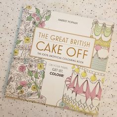 the great british cake off coloring book sits on a polka dot tablecloth covered surface