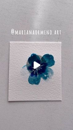 a piece of paper with blue flowers on it and the words marinana ormeno art