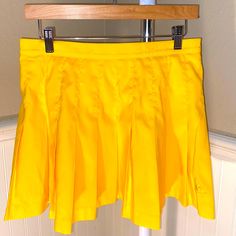 Brand New Ventige Le Coq Sportif Yellow Pleated Mini Skirt Size 10. Color Yellow! Preppy Yellow Bottoms For Spring, Preppy Flared Skort With Lined Skirt, Yellow Fitted Pleated Tennis Skirt, Fitted Yellow Pleated Tennis Skirt, Yellow Pleated Tennis Skirt For Spring, Yellow Pleated Mini Skort, Spring Yellow Pleated Tennis Skirt, Yellow Mini Pleated Skort, Yellow Pleated Skirted Skort