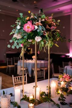 the centerpieces are decorated with candles and flowers