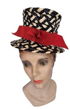 This amazing little hat is a Studio Styles creation. Braided plastic strips with a bright red ribbon. It is a wonderful little topper ~ tilt hat. Black & white with red ribbon. Labels read: An Original           Studio Styles           Warner Bros.            Designing Staff           Hollywood   Condition is very good. To wear or display. Perfect for film photography and/or museum. More of this period is to be listed soon. HAT BLOCK/MANNEQUIN NOT INCLUDED Buyer pays all related, USPS Priority, Retro Red Party Hat, Red Retro Party Hat, Handmade Red Party Hat, Red Fitted Vintage Top Hat, Vintage Red Mini Hat For Kentucky Derby, Vintage Red Costume Hat With Short Brim, Red Vintage Mini Hats For Kentucky Derby, Red Vintage Costume Hat With Short Brim, Handmade Red Straw Hat With Curved Brim