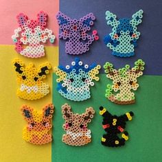 several different types of beaded animal pins