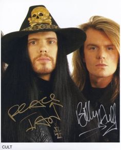 an autographed photo of two men with long hair