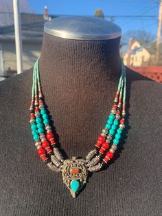 This is made from semi precious and imitation coral and turquoise and metal beads are made from German silver. And hand crafted by artisan in Kathmandu valley in Himalayas. It's is beautiful to hold and look, feels well made and expensive. Truly well crafted that last for ages. It's nomads jewelry. Southwestern Style Necklaces For Festivals, Southwestern Style Colorful Beads Jewelry For Festivals, Southwestern Jewelry With Colorful Beads For Festivals, Southwestern Style Jewelry With Colorful Beads For Festivals, Bohemian Hand-strung Jewelry For Rituals, Bohemian Beaded Necklaces For Healing And Festivals, Traditional Turquoise Beaded Necklaces For Meditation, Bohemian Hand-strung Turquoise Necklace For Festivals, Bohemian Natural Stone Beads For Festivals