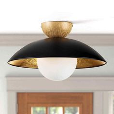 Discover timeless elegance with this modern industrial vintage semi-flush light, featuring a metal dome shade paired with an opal glass globe and a wooden top. Finished in gold leaf for added sophistication, this fixture requires one E26 60-watt bulb and offers full dimmability with suitable bulbs. Its versatile design complements farmhouse, mid-century, and transitional decors, perfect for enhancing living rooms, kitchens, and more with a retro-modern ambiance. New Arrivals Bathroom Ceiling Fans Kitchen Outdoor Lighting Pendants & Chandeliers New Arrivals Bathroom Ceiling Fans Kitchen Outdoor Lighting Pendants & Chandeliers This modern industrial vintage semi-flush light features a metal dome shade, an opal glass globe bubble and a wood top that looks classic yet modern. Gold leaf gives t Black And Brass Light Fixtures, Bathroom Ceiling Fan, Black And Brass Lighting, Bathroom Ceiling Fans, Brass Light Fixtures, Ceiling Fan Bathroom, Brass Light Fixture, Brass Light, Kitchen Redesign