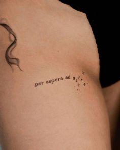 a woman with a tattoo on her left arm that says per aspera ad