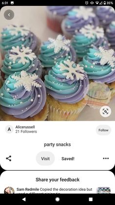 some cupcakes with blue frosting and snowflakes on them are being viewed on an iphone