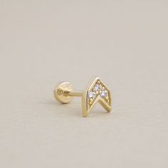 All of our jewelry is handmade per order to make sure you will have the highest quality and our goal is to give you the this value at the lowest price possible. Aim for stylish sophistication with this 14K Gold Arrow Piercing. Designed for tragus or helix piercings, this minimalist arrow stud features a sleek and contemporary design that adds a modern edge to your ear stack. Crafted from solid gold, it offers both durability and elegance, making it a perfect choice for everyday wear or special o Minimalist 14k Gold Jewelry With Prong Setting, Dainty 14k Gold Jewelry With Prong Setting, Minimalist 14k Gold Hallmarked Jewelry, Minimalist Yellow Gold Jewelry With Prong Setting, Minimalist Gold Jewelry With Diamond Accents, Arrow Piercing, Helix Piercings, Gold Arrow, Piercing Tragus