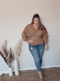 This stunning Long Sleeve Solid Knit Surplice V Neck Sweater features a fitted waist, delicate ruffled peplum, and a captivating open back with crossstrap detailing. 100% Acrylic Fit: True to size Camel Sweaters, Classic Sweater, V Neck Sweater, Vneck Sweater, Neck Sweater, Open Back, Camel, Twist, V Neck