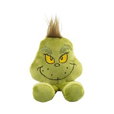 a green stuffed animal with yellow eyes and hair on it's head, sitting against a white background