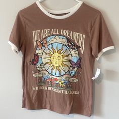 Size S. Super Soft And Cute Hippy Light Brown Ringer T-Shirt! New With Tags Size Small. Features Lots Of Flora And Fauna Including The Sky, Clouds, The Sun, Fungi And Mushrooms, Butterflies, Flowers, And Grass. Features A Logo “We Are All Dreamers With Our Heads In The Clouds.” So Hippie Whimsigothic Witchy Y2k Astrology Vibes. Eclectic Townhouse, Heads In The Clouds, Hippie Clothing, Butterflies Flowers, Hippie Shirt, Sun Shirt, Ringer Tee, In The Clouds, Hippie Outfits