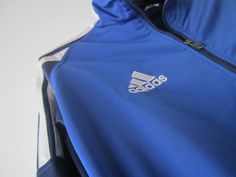 "Vintage Blue Adidas Jacket Blue Adidas Zipper Running Jacket Unisex Jogging Parka Blue Soccer Jacket Three Stripes Size Large Adidas Cardigan Label size: D 176; GB 34/36; F 16A Measurements: (lying flat) Length - 28.5\"/ 72.5 cm Shoulders: 20\"/ 51 cm Pit to pit: 22.5\"/ 57 cm Waist: 19.5\"/ 49.5 cm Sleeve: 22.5\"/ 57 cm Please check measurements to insure a proper fit. Remember to allow yourself some extra room for movement. You can compare these with something from your closet that fits you w Blue Sportswear Track Jacket For Fall, Blue Track Jacket For Fall Sportswear, Blue Track Jacket For Fall, Blue Sports Outerwear With Zipper Closure, Blue Sports Track Jacket With Zipper Closure, Blue Sporty Track Jacket With Zipper, Blue Long Sleeve Track Jacket For Outdoor, Dress 70s Style, Adidas Jumper