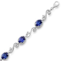 Oval Created Blue Sapphire and Round Natural White Diamond Accents Sterling Silver Bracelet With Prong Setting,Measure Approximately 174.80'' L x 3/16'' H x 17/64'' W Oval Blue Gemstone Bracelets, Formal Sapphire Oval Bracelets, Formal Sapphire Oval Bracelet, Oval Blue Jubilee Bracelet, Classic Blue Bracelets, Formal Adjustable Oval Bracelet, Blue Oval Jubilee Bracelet, Prom Planning, Blue Diamond Jewelry