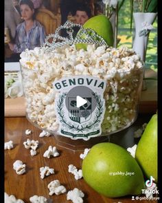 an apple and some popcorn on a table