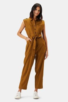 Form meets function in our casually cool utility-inspired jumpsuit. With plenty of pockets and ultimate comfort, it's a one-and-done style you'll be sporting for years. Slim-fitting, sleeveless jumpsuit with inset shoulder detailing and front placket Multiple patch pockets Self-tie belt at waist 49% Linen, 36% Lyocell Olive Jumpsuit, Outfit Female, Brown Jumpsuits, Stretch Jumpsuit, Utility Jumpsuit, One Piece Outfit, Sleeveless Jumpsuits, Sustainable Materials, Comfortable Outfits