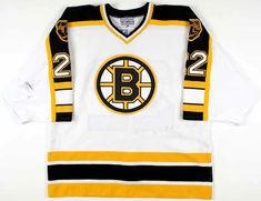 an old boston hockey jersey with the number 22 on it's chest and black and yellow stripes