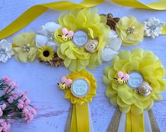 some yellow flowers and ribbons on a table