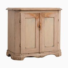 an old wooden cabinet with two doors