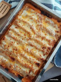 a square casserole dish with cheese on top