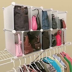 a rack with multiple bags and purses on it