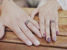 two people with wedding rings on their fingers