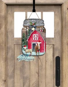 a red barn door with a glass hanging from it's side and an image of a cow on the front