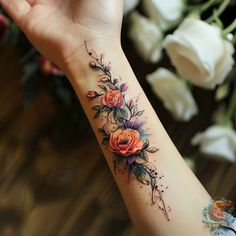 a woman's arm with flowers on it