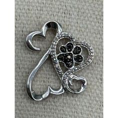 This Listing Is For A Jane Seymour Open Heart Sterling Silver Family Paw Print Black Diamond Pendant. It Is In Good Preowned Condition With Use Related Wear, There Are Scratches To The Silver And A Couple Small Spots Of Tarnish On The Inside Edge. Please Look Closely At All Photos For Condition. If You Have Any Questions, Please Message Me. Thanks For Looking At My Listing! Open Heart Jewelry Jane Seymour, Black Diamond Pendant, Jane Seymour, Kay Jewelers, Open Heart, Diamond Pendant, Black Diamond, Paw Print, Womens Jewelry Necklace