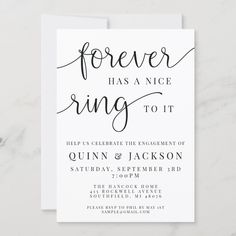 a white wedding card with the words forever has a nice ring to it on it