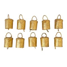 twelve brass bells with handles on each side, all in the same pattern and shape