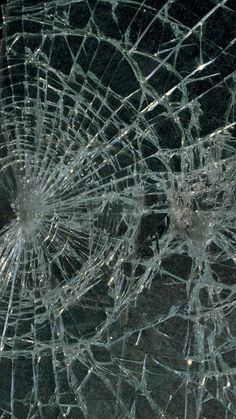 a cracked glass window that has been shattered