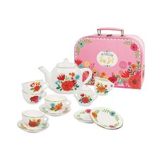 the tea set is pink with flowers on it and has four cups, two saucers,