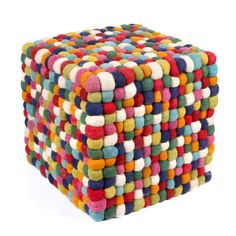 a multicolored cube made out of felt