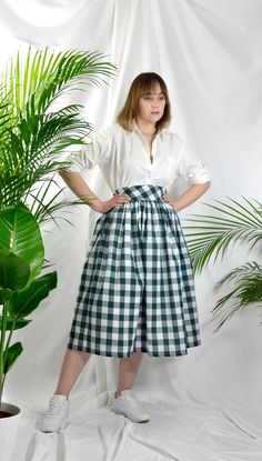 "Forest Green check high waist full gathered skirt. Perfect for casual outfits and special ocasions with pair of trainters or high heels. 100% cotton.  Elastic at the back of waist.  Two side pockets. Midi lenght about 70cm + 5 cm waistband. Handmade in UK.  Model wears size S.  HOW TO CHOOSE A SIZE ?   Using a measuring tape, measure the smallest part of your waist.  SIZE CHART: (CM) XS - W: 66 CM S - W: 70 CM M - W: 74 CM  L - W: 78 CM  XL - W: 82 CM  CARE INSTRUCTIONS: Hand wash only, do not bleach, hang dry, do not tumble dry, press with a cool iron on the reverse side.  Please message me before purchasing so I can check availability. If you wish this skirt in any other fabric, shorter or longer \"send message to seller\" and we can try to make something especially for you. *Depends on Casual Gingham Gathered Skirt, Gingham Gathered Skirt Bottoms For Spring, Spring Gingham Gathered Skirt Bottoms, Gingham Gathered Skirt For Spring, Classic Cotton Bottoms With Voluminous Skirt, Spring Gingham Gathered Skirt, Fitted Cotton Skirt For Picnic, Classic Cotton Voluminous Skirt, Classic Voluminous Cotton Skirt