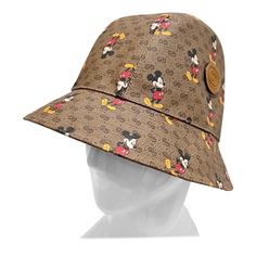 Mickey Monogram Bucket Hat by Disney X Gucci Spring/Summer 2020 Made in Italy Brown with vintage Gucci monogram throughout Mickey Mouse graphic intermixed throughout Interlocking G Gucci logo stamped on leather patch Fabric Composition; 50% polyester, 50% cotton, (100% cotton lining) New With Tags, Includes Original Hat Box Size/Measurements: (approximate, taken flat) Size Medium 58 cm (22.83") Gucci Spring, Gucci Logo, Gucci Monogram, Hat Box, Berets, Logo Stamp, Suitcases, Leather Patches, Vintage Gucci