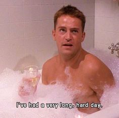 a man sitting in a bathtub full of bubbles with the caption i've had a very long, hard day