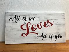 a wooden sign that says, all of me loves all of you