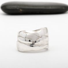 This "Odin" silver ring is handmade in Fine Silver (99.9% pure silver). This unique piece is entirely molded by hand, using the silver clay technique. The style of this ring is inspired by the Vikings and the Old Norse mythology. Browse our complete collection of custom one of a kind fine silver jewelry. Silver Hand Forged Wide Band Open Ring, Artisan Sterling Silver Wide Band Ring, Unique Sterling Silver Jewelry With Thick Band, Unique Thick Band Sterling Silver Jewelry, Unique Sterling Silver Rings With Thick Band, Hand Forged Wide Band Sterling Silver Ring, Artisan Sterling Silver Ring With Polished Finish, Silver Hammered Open Band Rings, Unique Engraved Wide Band Ring In Sterling Silver