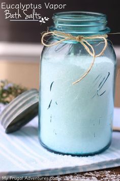 a jar filled with white liquid sitting on top of a table