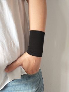 Wide fabric wrist cuff bracelet in black - CHOOSE YOUR COLOR from the drop down menu. Visit my shop for more colors. https://www.etsy.com/shop/VinciBazaar Handbands, wrist cuffs, wrist wraps - visit my shop for more color matching accessories When ordering the Set of 2, 3 or 4 - Please specify in the "Notes" when purchasing, which color combination you would like. *Handmade with love and care in a smoke free home *Every wrist cuff is sewn by me *Double layered *Ideal for covering wrist tattoos * Wrist Tattoo Cover Up, Fabric Cuff Bracelet, Cotton Bracelet, Tattoo Cover Up, Fabric Bracelets, Tattoo Cover, Tattoo Cover-up, Wrist Tattoo, Wrist Wrap