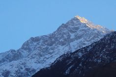 the top of a mountain covered in snow