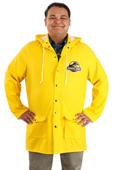 a man in a yellow rain coat standing with his hands on his hips and smiling