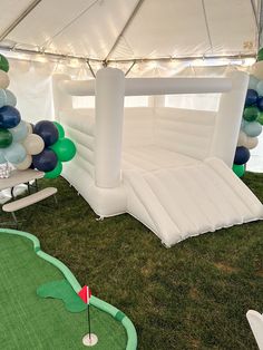 an inflatable golf course set up with balloons