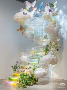 a staircase made out of clouds and flowers with butterflies flying over it in the air