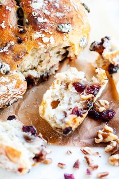 cranberry and pecan biscuit muffins are on a cutting board